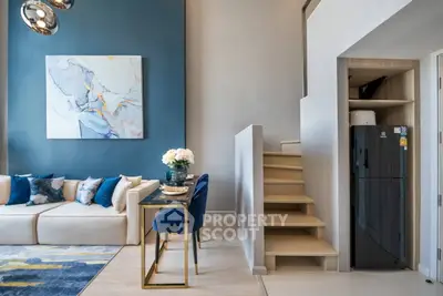 Modern duplex living room with stylish decor and compact staircase