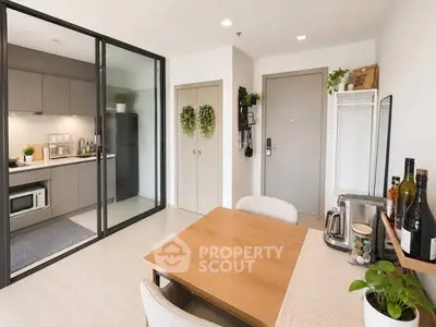 Modern open-plan kitchen and dining area with sleek design and natural light.