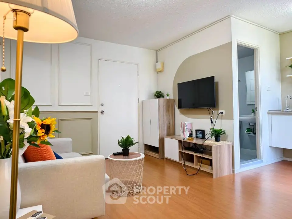 Charming living room with modern decor and open kitchen layout