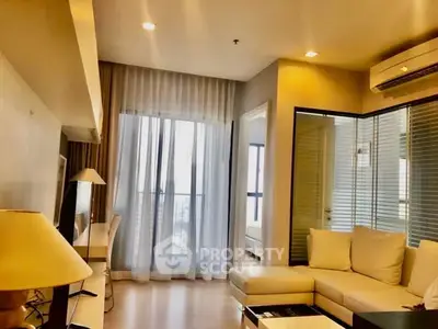 Modern living room with cozy seating and natural light