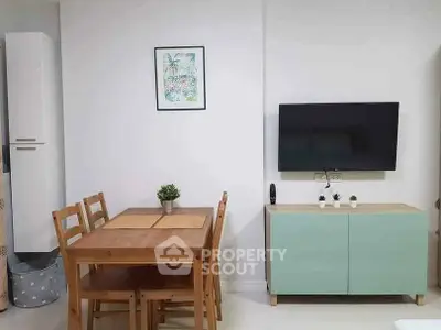 Modern living room with wooden dining set and wall-mounted TV