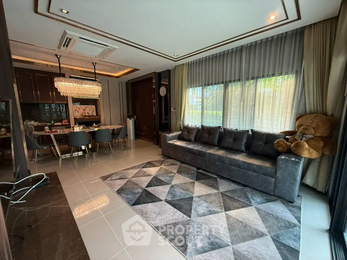 Luxurious living room with modern decor and plush seating in a stylish home.