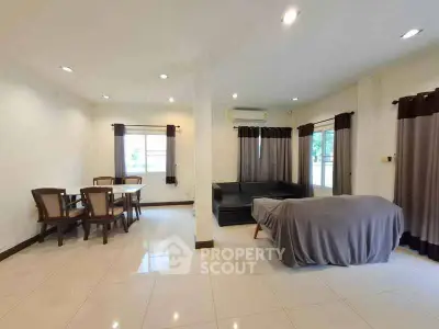 Spacious living room with modern furniture and ample natural light