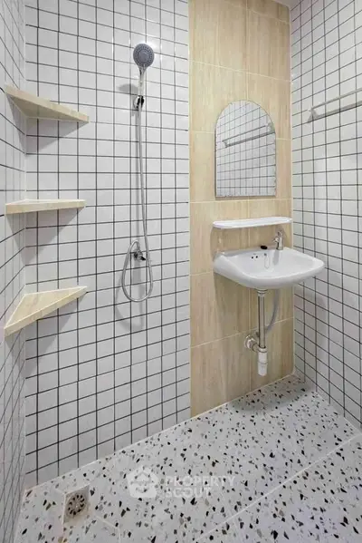 Modern bathroom with sleek shower and stylish tiles, perfect for contemporary living.