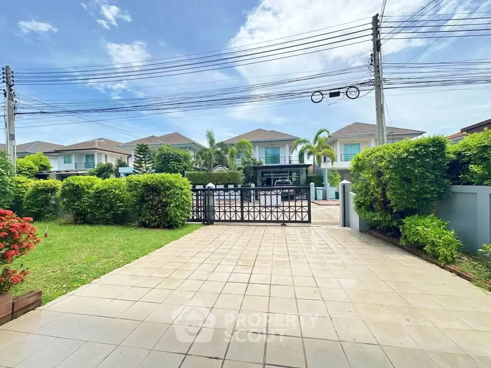 Charming suburban home with lush garden and gated driveway, perfect for family living.