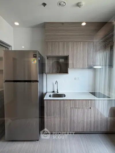 Modern kitchen with sleek cabinetry and stainless steel appliances