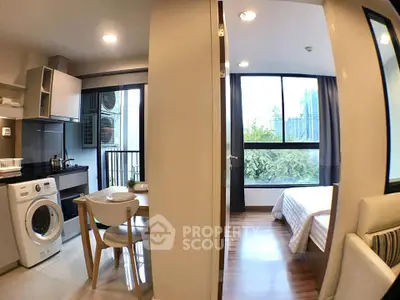 Modern apartment interior with kitchen, dining area, and bedroom featuring large windows and natural light.