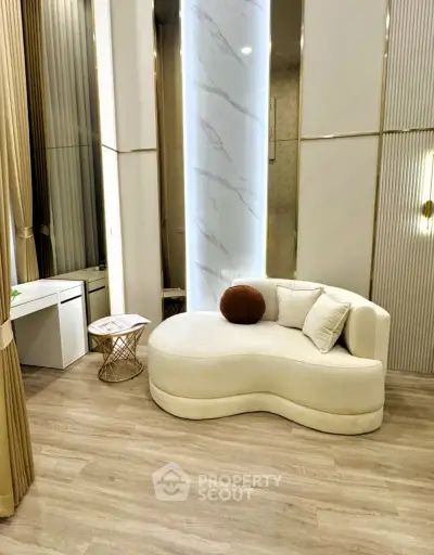 Luxurious modern living room with elegant curved sofa and stylish decor