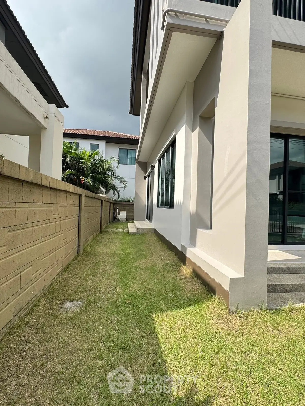 Modern residential property with spacious side yard and contemporary architecture.