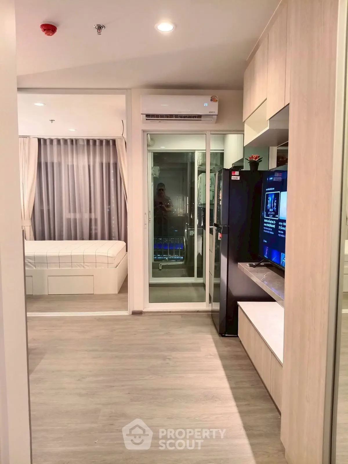 Modern apartment interior with sleek design, featuring a cozy living area and stylish bedroom.