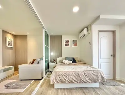 Modern studio apartment with cozy bedroom and stylish decor