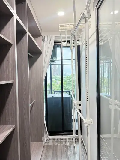 Spacious walk-in closet with large window and city view, featuring modern shelving and ample storage space.