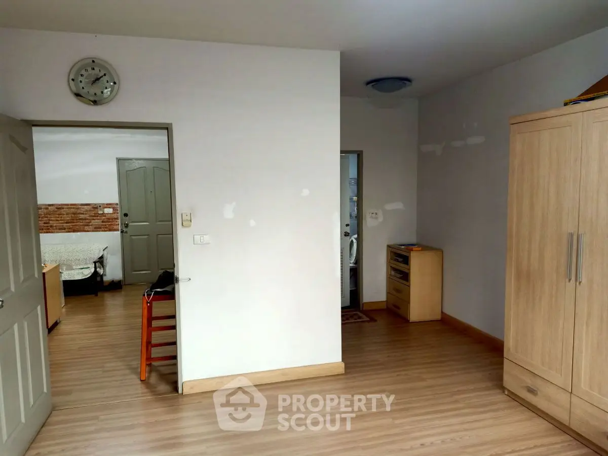 Spacious interior with wooden flooring and modern furnishings