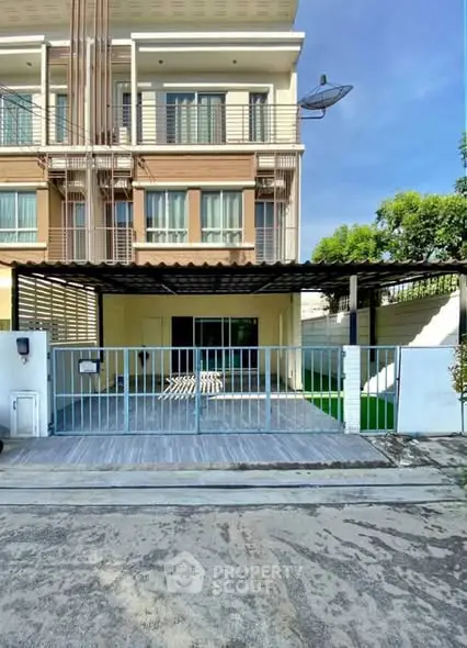 Modern townhouse with gated parking and balcony in a serene neighborhood.