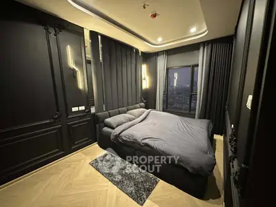 Luxurious modern bedroom with city view and elegant black decor