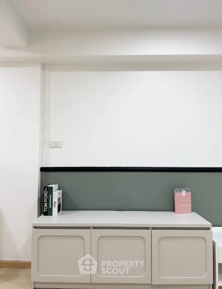Minimalist interior with sleek storage unit and modern decor accents
