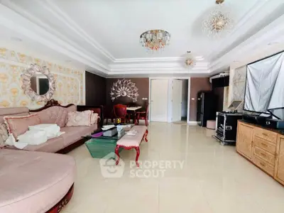 Luxurious living room with elegant decor and plush furniture in a spacious apartment.