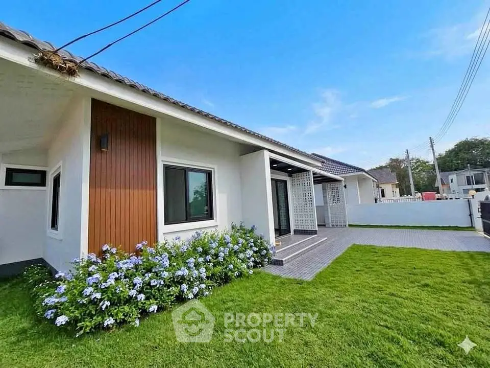 Charming modern house with lush garden and stylish facade in serene neighborhood.