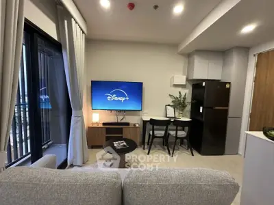 Modern living room with cozy sofa, TV, and dining area in stylish apartment