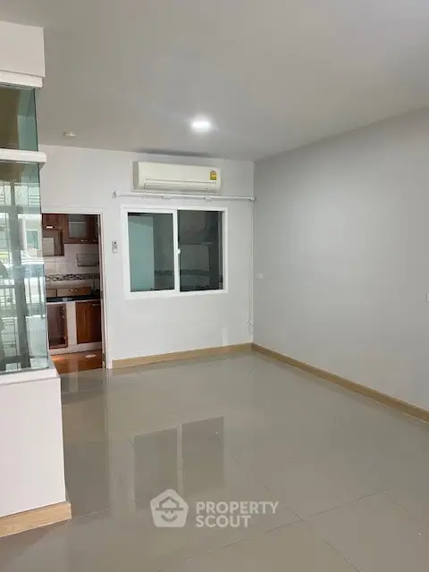 Spacious living room with modern kitchen in open layout apartment