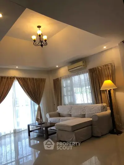 Elegant living room with cozy white sofa and ambient lighting