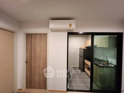 Modern apartment interior with air conditioning and sleek kitchen design