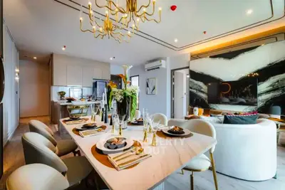 Luxurious open-plan living and dining area with elegant decor and modern furnishings.