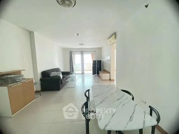 Spacious living room with modern furniture and natural light