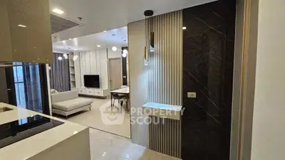 Modern open-plan living room with sleek kitchen and stylish decor