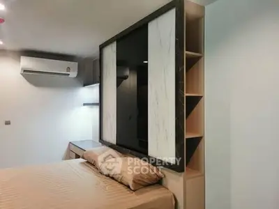 Modern bedroom with stylish partition and air conditioning unit