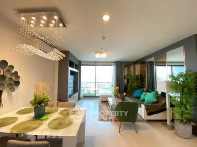 Spacious modern living room with elegant decor and large windows offering a stunning view.