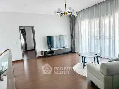 Spacious modern living room with elegant decor and large windows