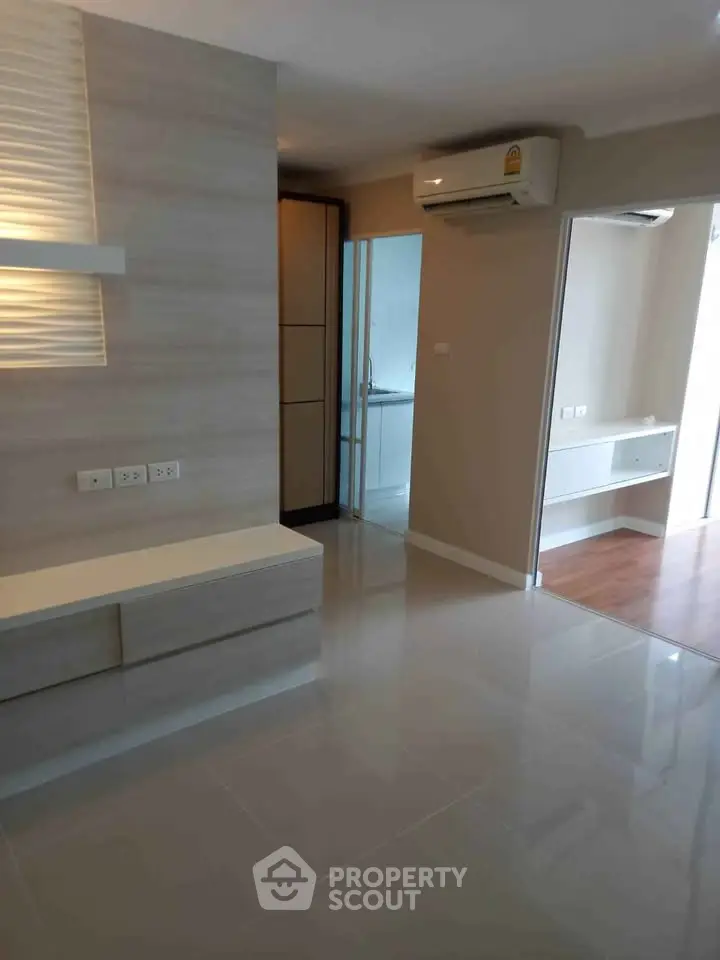 Modern apartment interior with sleek design and air conditioning, featuring a spacious layout and contemporary finishes.