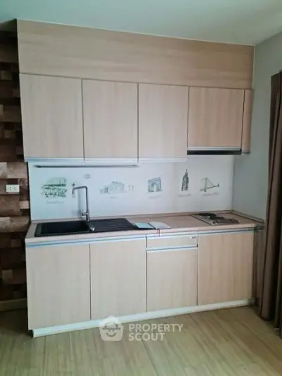 Modern compact kitchen with sleek wooden cabinets and artistic backsplash