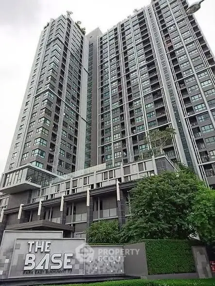 Modern high-rise condominium with sleek design and lush greenery at The Base Park East.