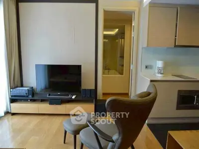 Modern living room with stylish furniture and open kitchen layout