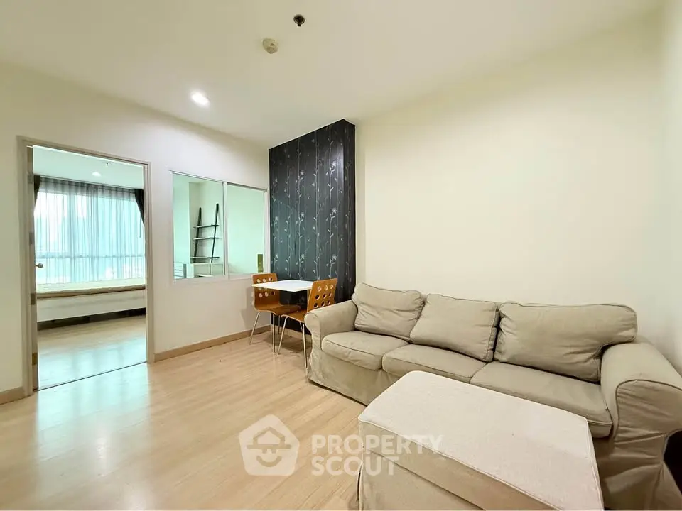 Spacious living room with cozy sofa and dining area in modern apartment