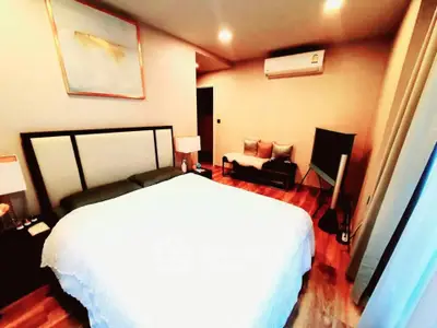 Luxurious bedroom with modern decor and ambient lighting