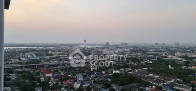 Stunning cityscape view from high-rise apartment balcony at sunset