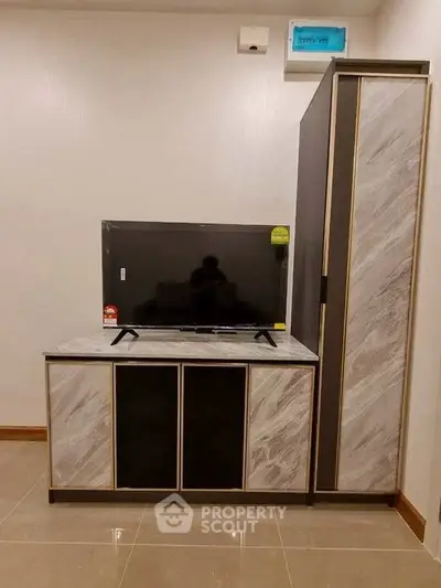 Modern living room with sleek TV stand and storage cabinet