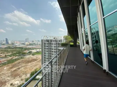 Stunning high-rise balcony with panoramic city views and modern design.