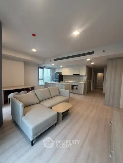 Spacious modern living room with open kitchen in a stylish apartment