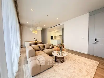 Spacious modern living room with open kitchen and elegant decor