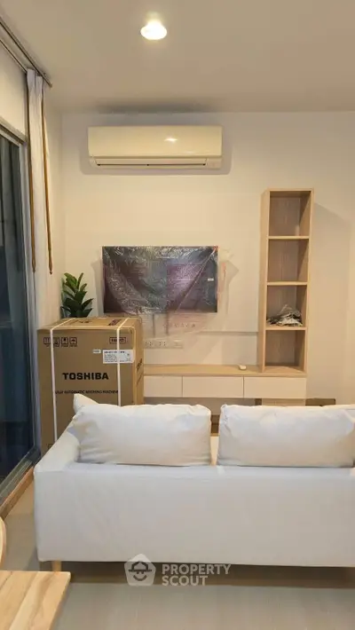 Modern living room with new air conditioner and stylish furniture