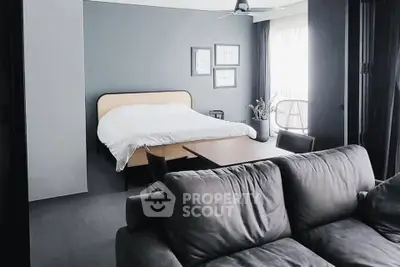 Modern studio apartment with cozy living area and stylish decor