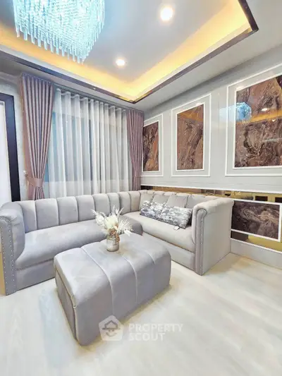 Luxurious living room with elegant sofa and modern chandelier