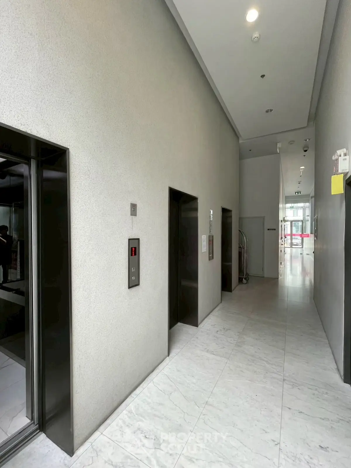 Modern building elevator lobby with sleek design and marble flooring