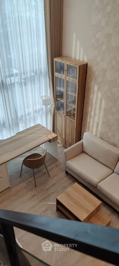 Modern living room with elegant furniture and large window