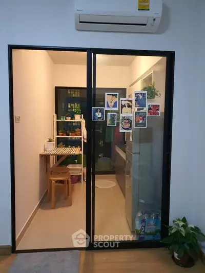 Cozy kitchen with modern appliances and stylish decor in a compact space.