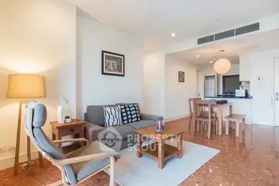 Spacious living room with modern furniture and open layout in a stylish apartment.
